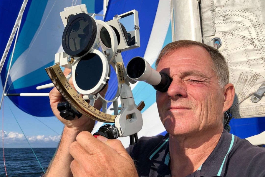 Tapio Lehtinen using a sextant on board Asteria