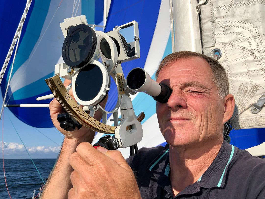 Tapio Lehtinen using a sextant on board Asteria